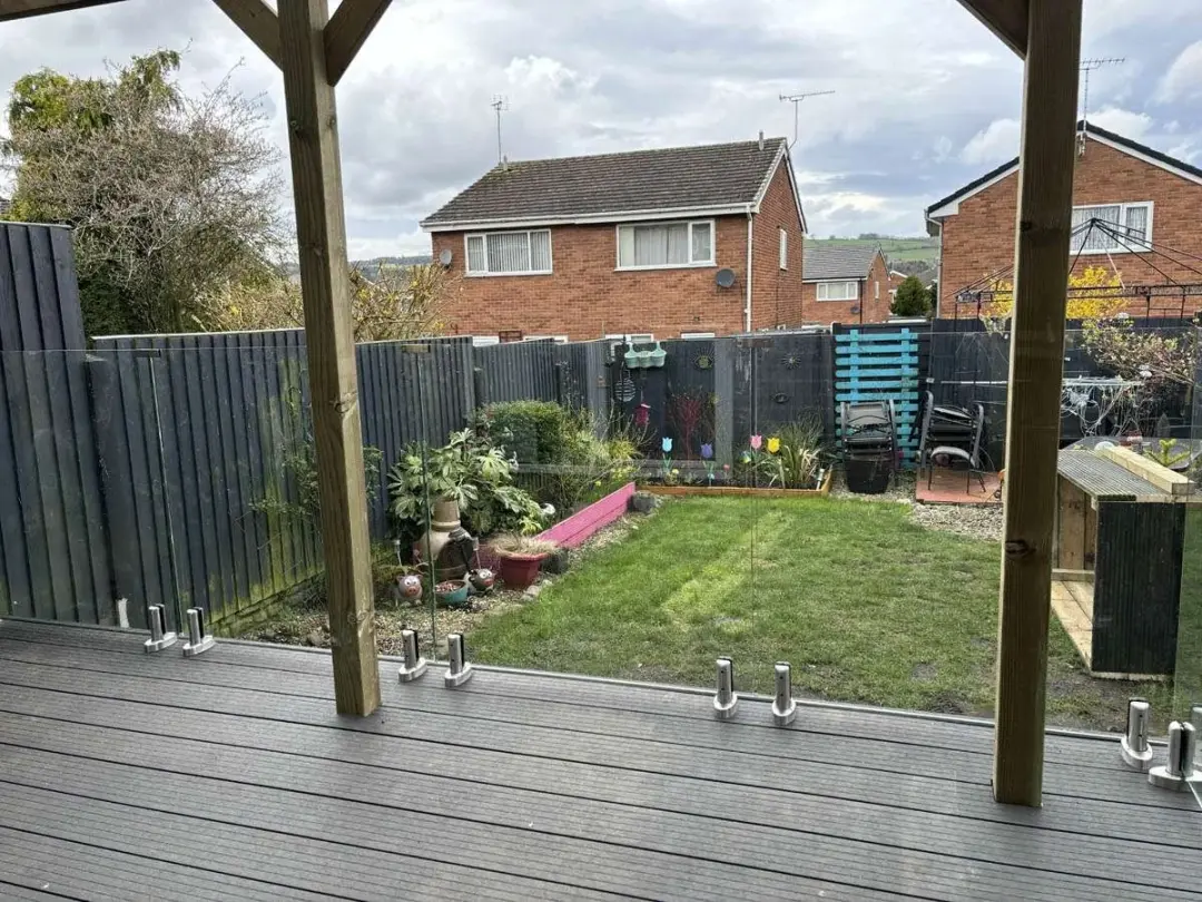 Grey composite deck with a glass balustrade