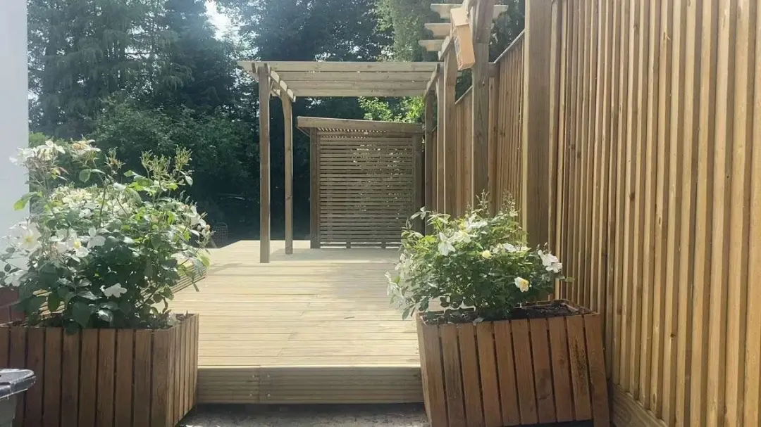 Timber deck with planters under a pergola