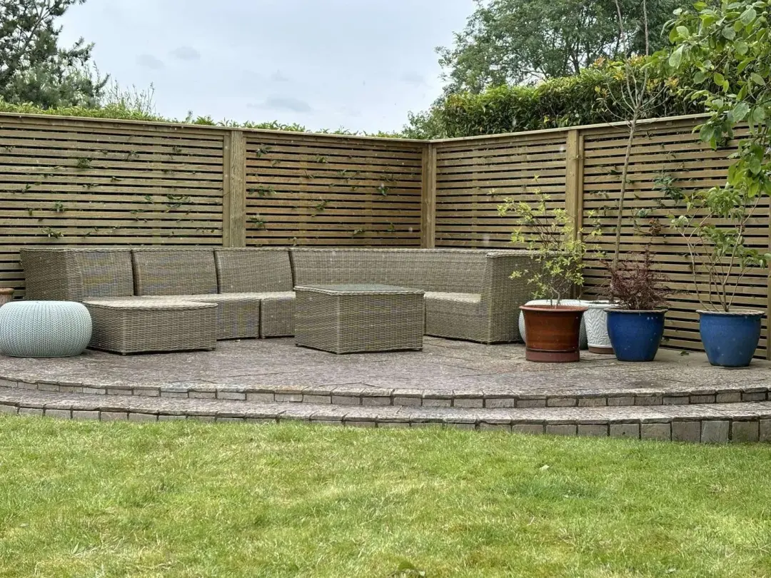 Venetian slatted fencing around a patio